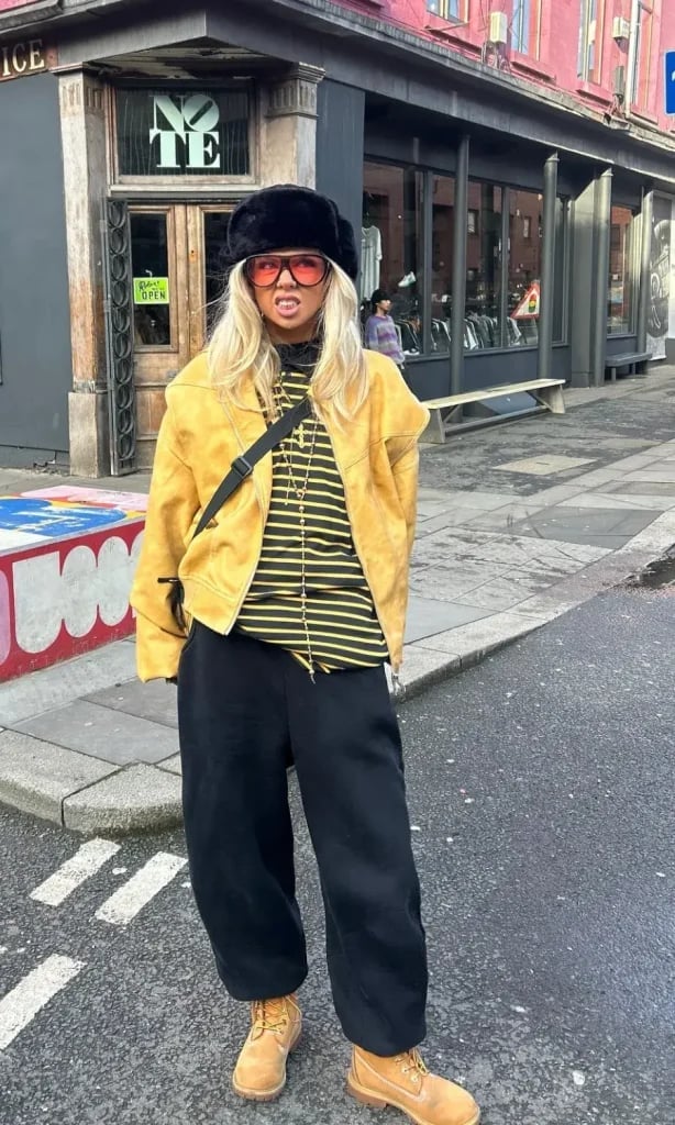Black Sweatpants with Yellow Suede Jacket — Cute Sweatpants Outfit Inspo