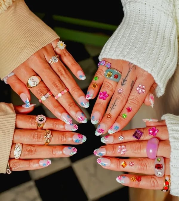 Medium Oval French Tips with Floral Gems Medium Oval French Tips with Floral Gems — Cute Trendy Nails
