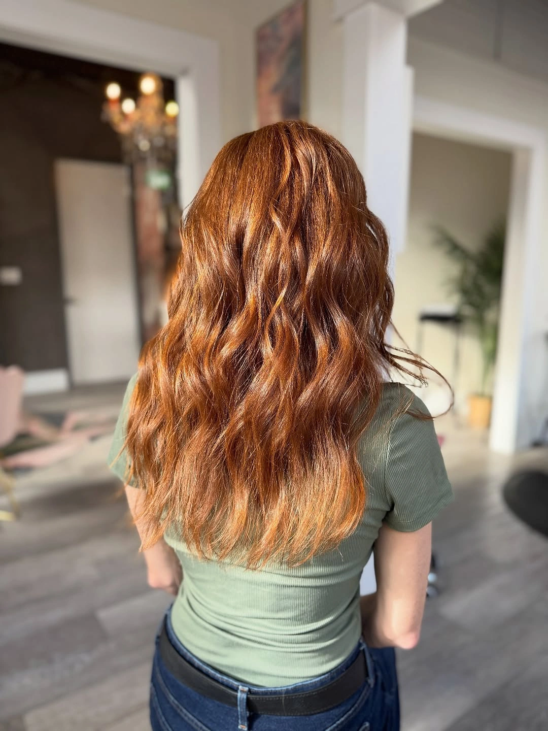 Long copper auburn waves with bright golden orange strands throughout