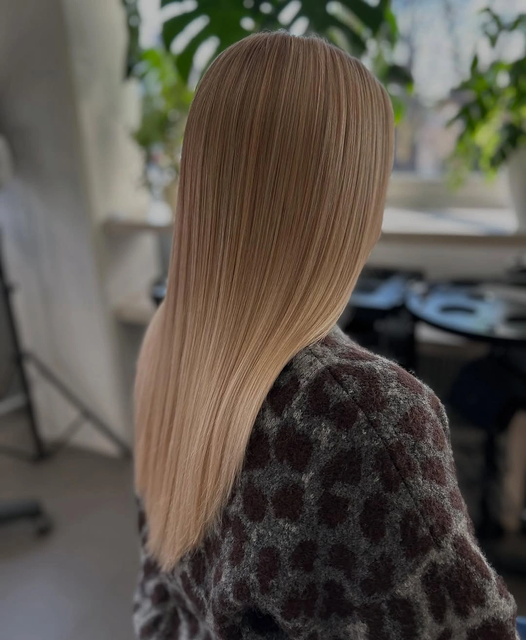Long straight light beige blonde hair with subtly darker roots