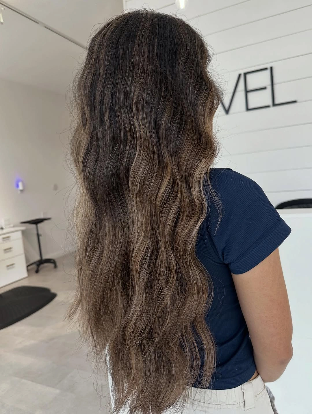 Very long cool mushroom brown waves with darker roots and muted taupe strands