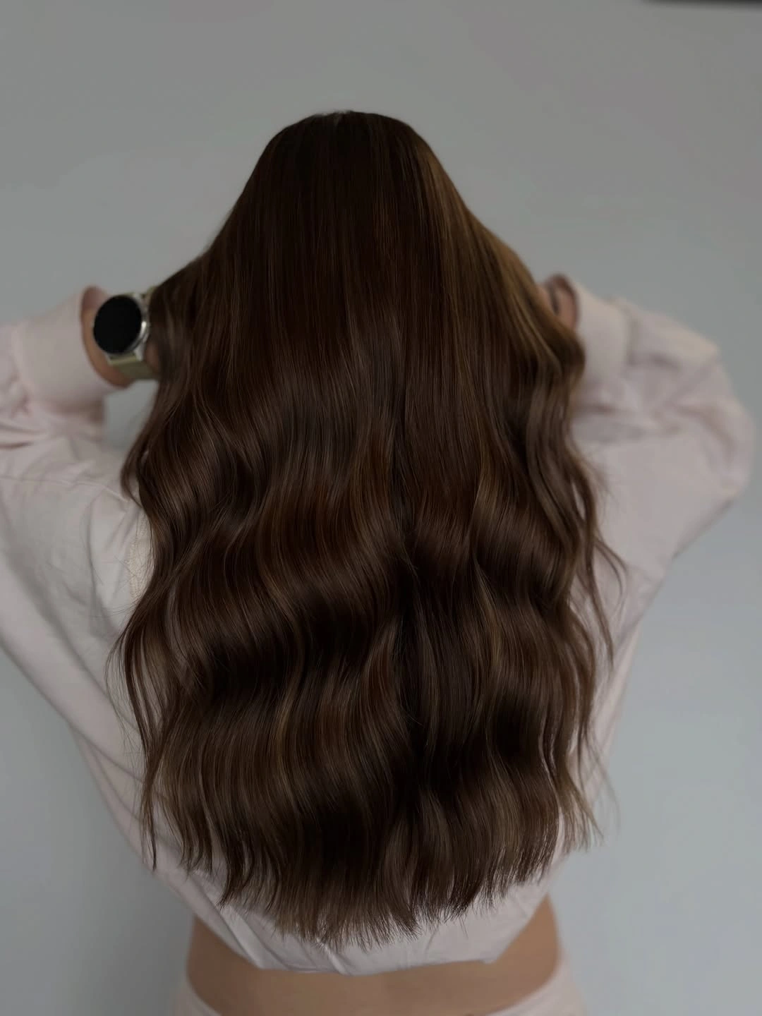 Long deep chocolate brown hair with broad loose waves and subtle brown reflections