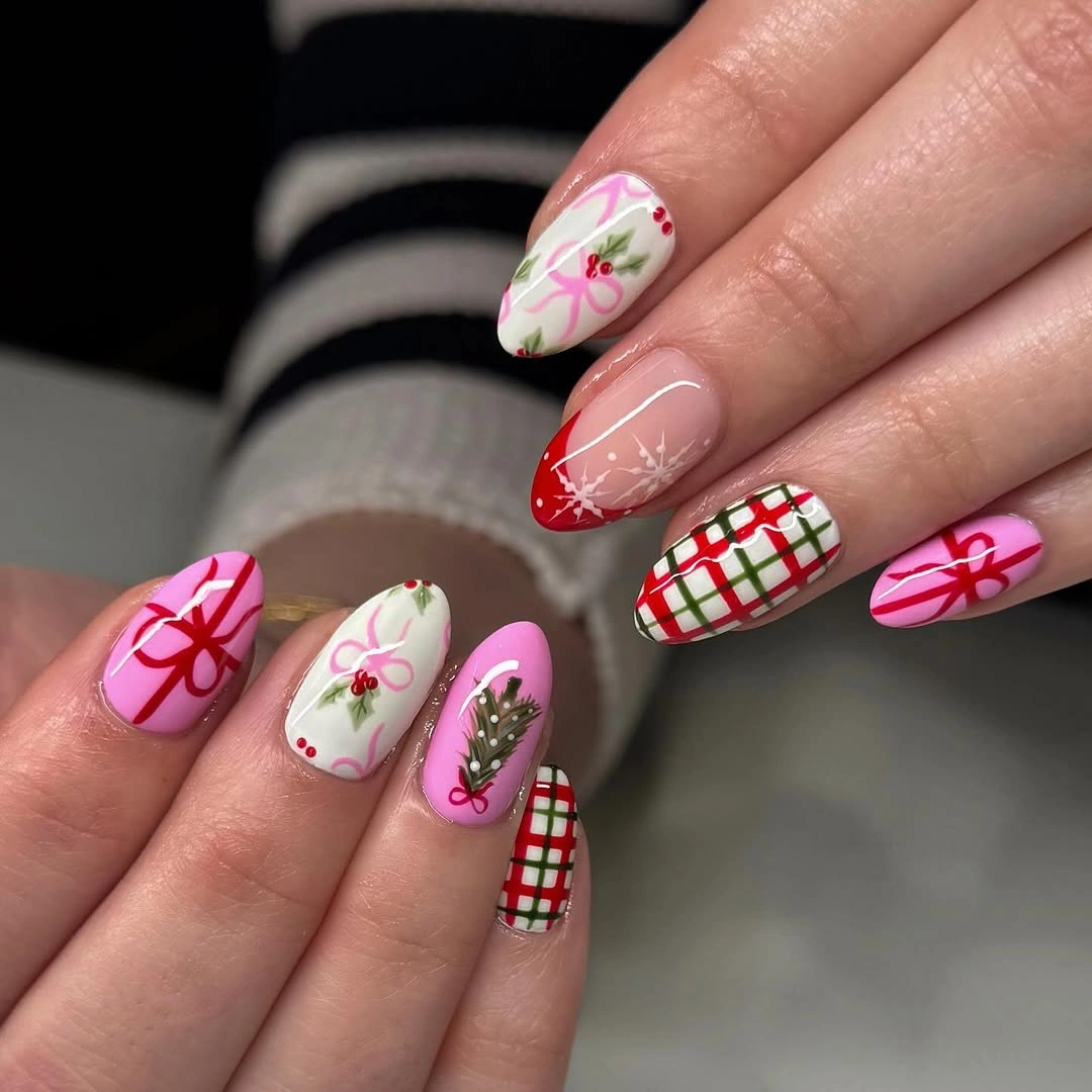 Long pink and white nails with red bows, plaid, and green tree details