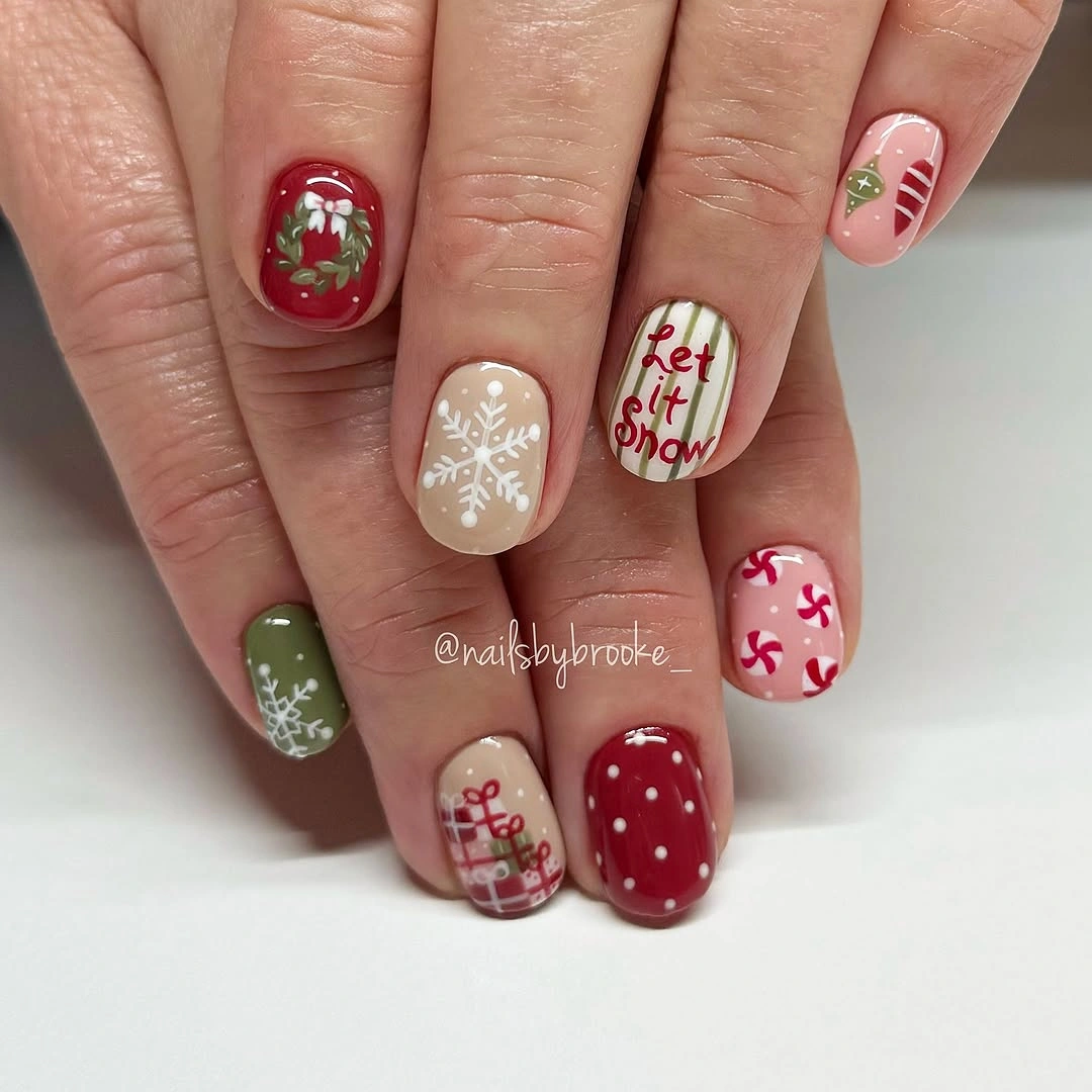 Short rounded Christmas nails with snowflakes, wreaths, plaid, and red lettering