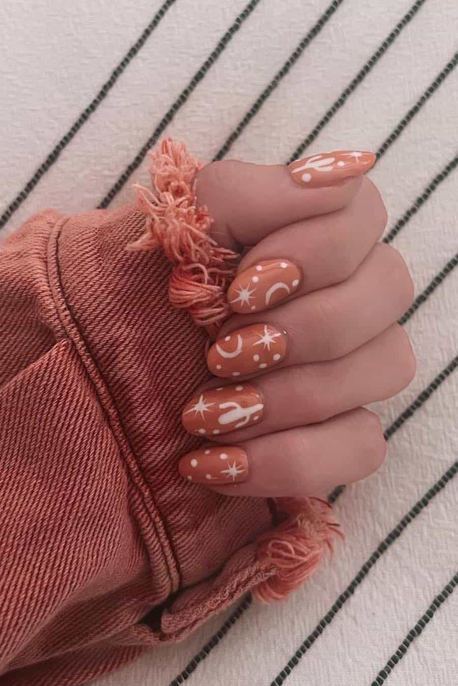 Medium Oval Orange with White Western Motifs Medium Oval Orange with White Western Motifs — Easy Western Nails