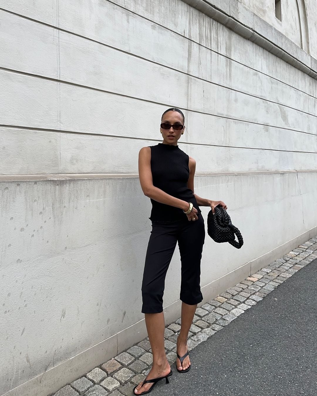 All Black Capris with a Ribbed Knit Top and Woven Bag — Elegant Black Capri Pants Outfit