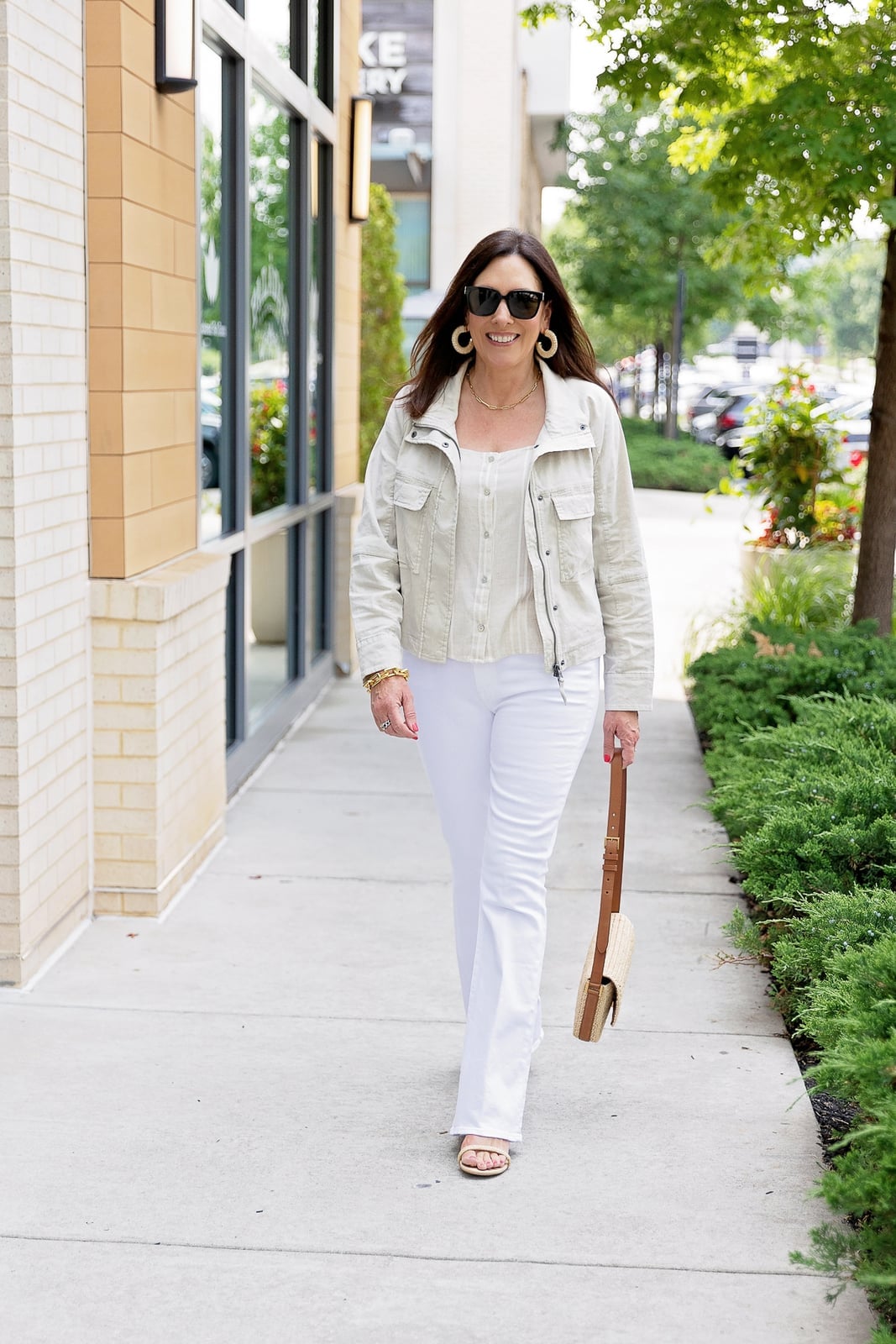 Light Beige Utility Jacket Over Striped Tank With Gold Hoop Earrings — Elegant White Jacket Outfit