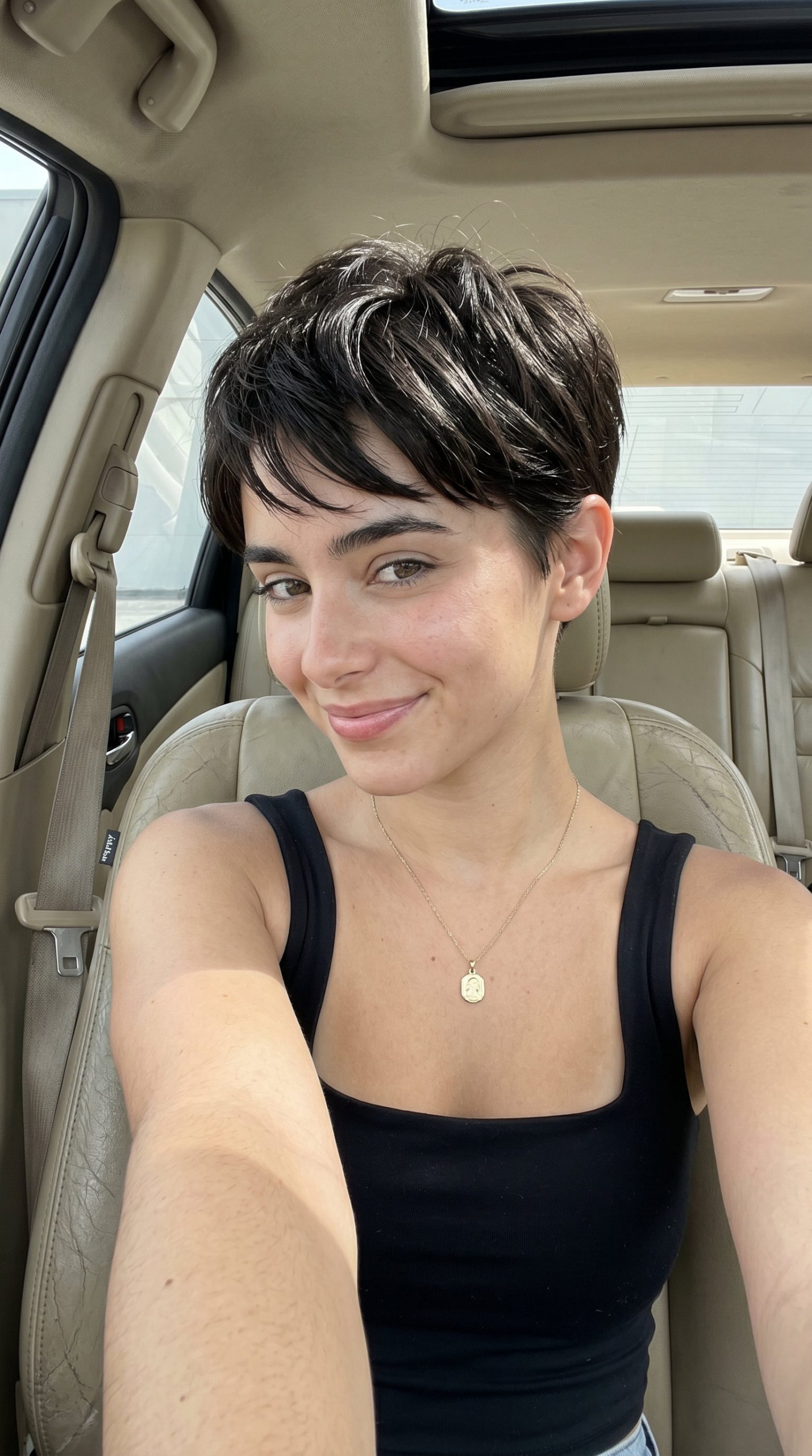 very short pixie haircut with espresso brown, point-cut texture and razor fade for modern look