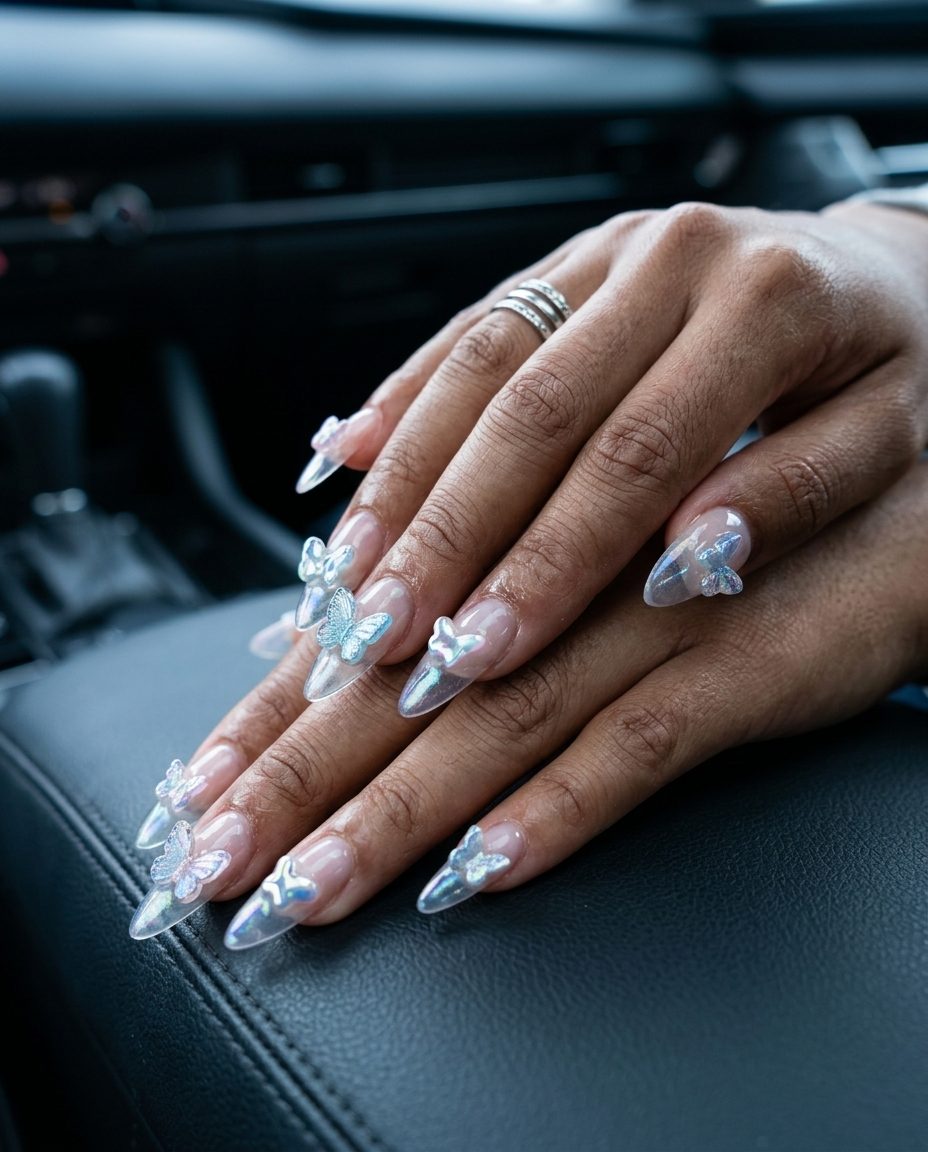 Y2K Charm Stiletto nails with iridescent pastel charms for fun summer nails 2026. Glamorous party look.