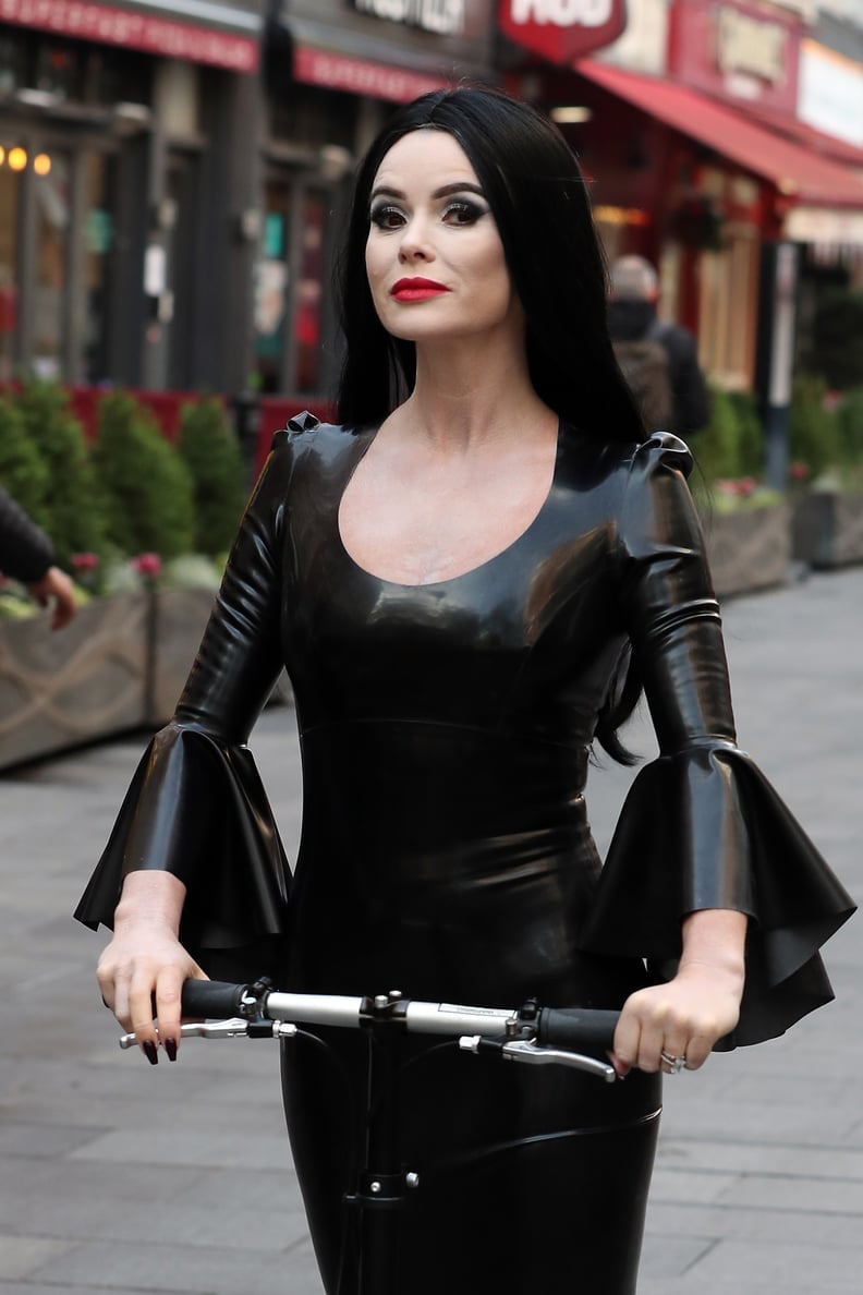 Black Latex Dress with Dramatic Bell Sleeves, Close-Up Take Black Latex Dress with Dramatic Bell Sleeves, Close-Up Take — Goth Style Ideas