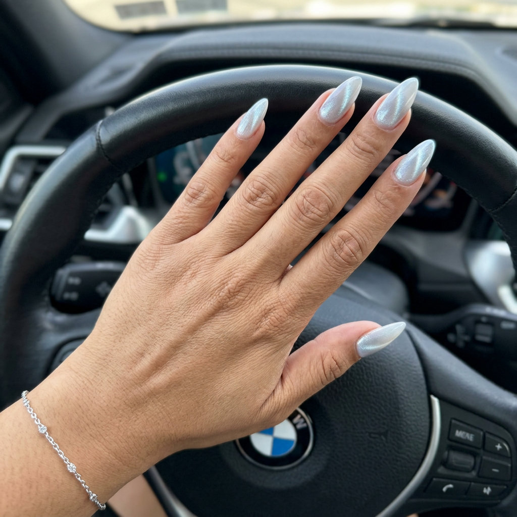 Milky white cat-eye stiletto nails in silver-blue for june nails ideas - summer 2026. Glamorous, mystical, bold party style.