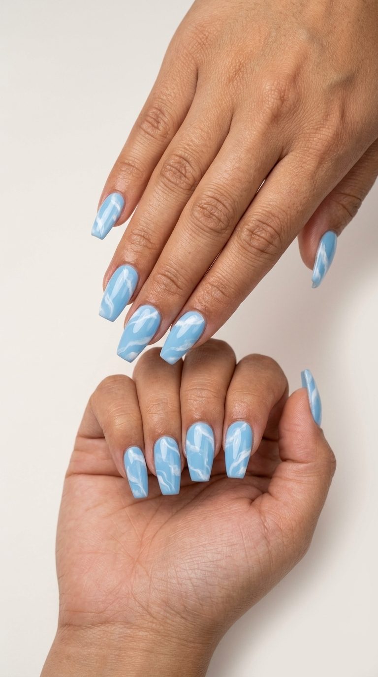 Sky blue and white swirls coffin nails for june nails ideas - summer 2026. Whimsical, dreamy, calm casual style.