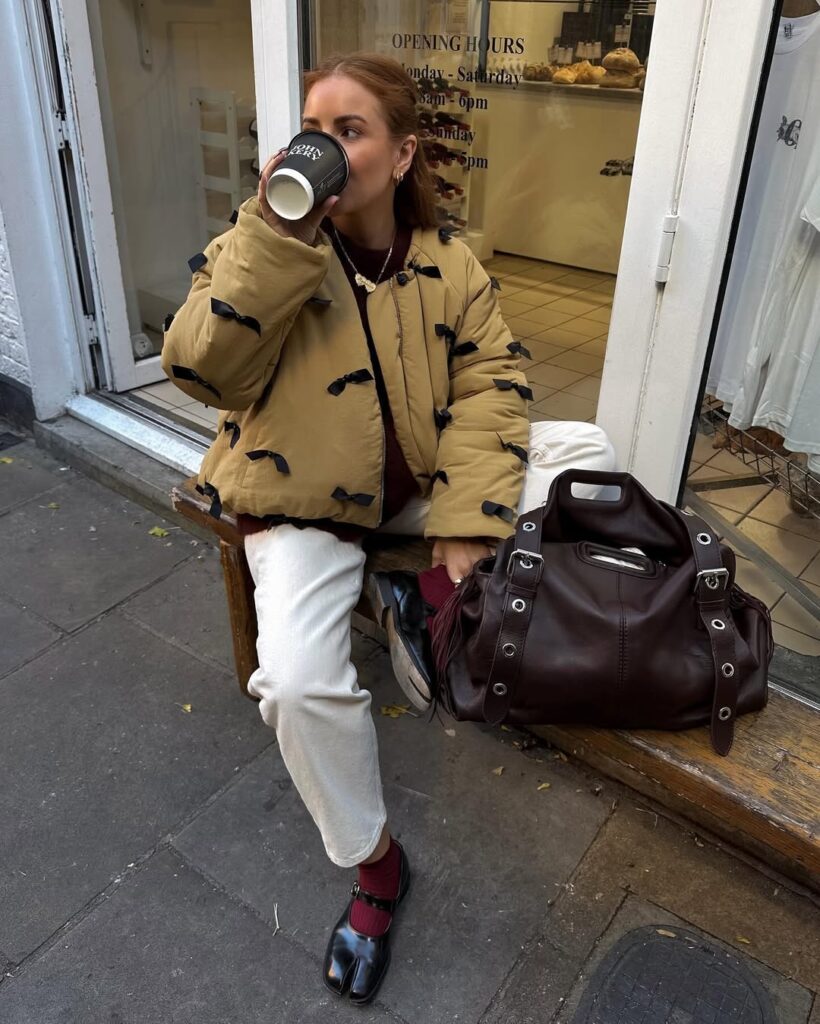 Chic Tan Puffer Jacket with Black Bow Details — Cold Weather Outfits