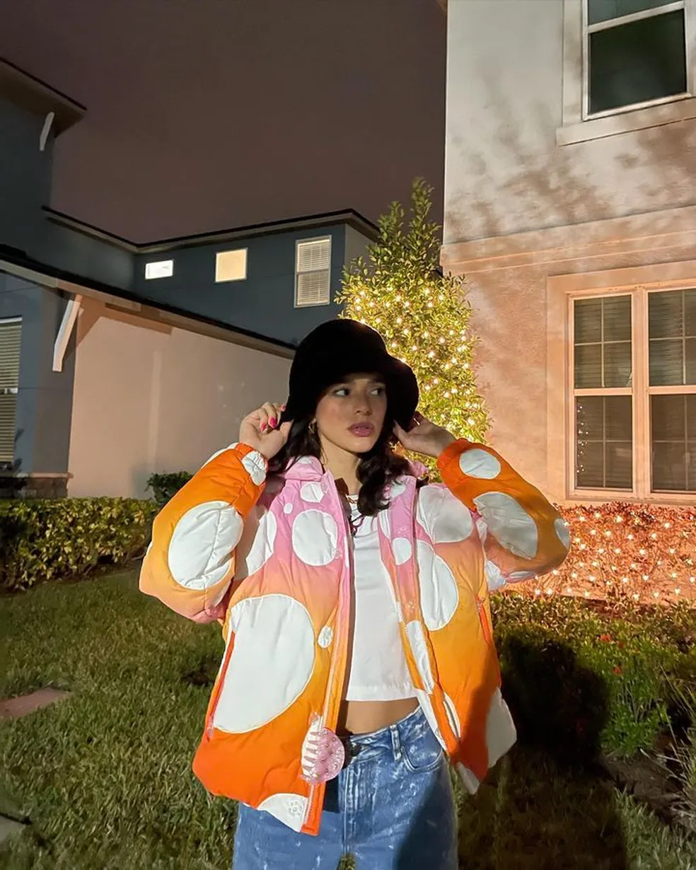 Gradient Circle Puffer Jacket with Blue Jeans and Bucket Hat — Winter Puffer Jacket Outfits