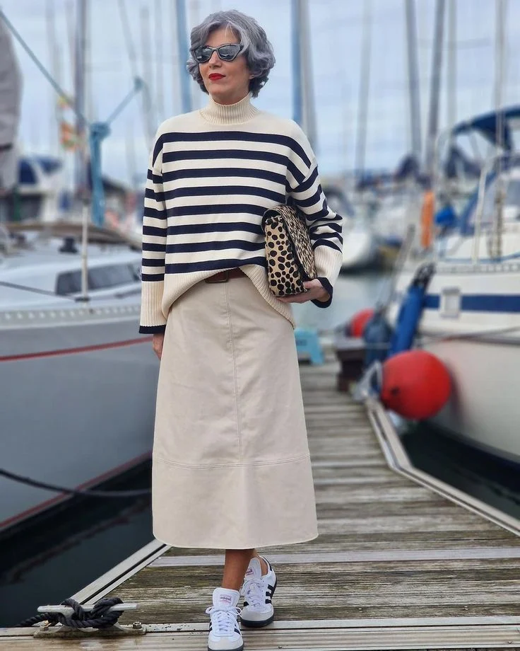 Grey Sweatshirt Layered with Pleated Skirt and Loafers — Winter Outfits for Women Over 60