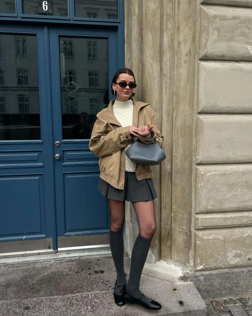 Bomber Jacket Chic: Tan Bomber with Mini Skirt and Knee-Highs — Winter College Outfits