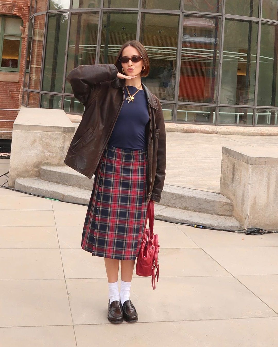 Leather Jacket and Plaid Midi Skirt for a Casual Concert — Winter Concert Outfits