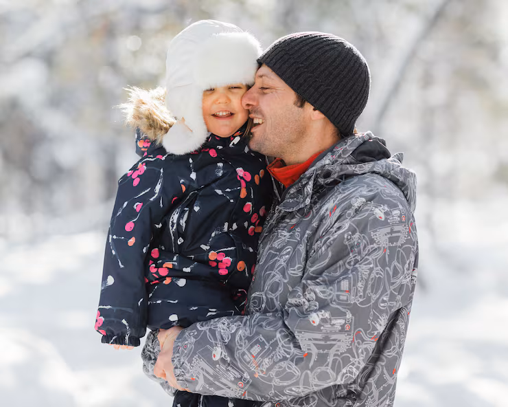 Playful Puffer Jackets: A Child's Printed Outerwear Steals the Scene — Winter Family Photo Outfits