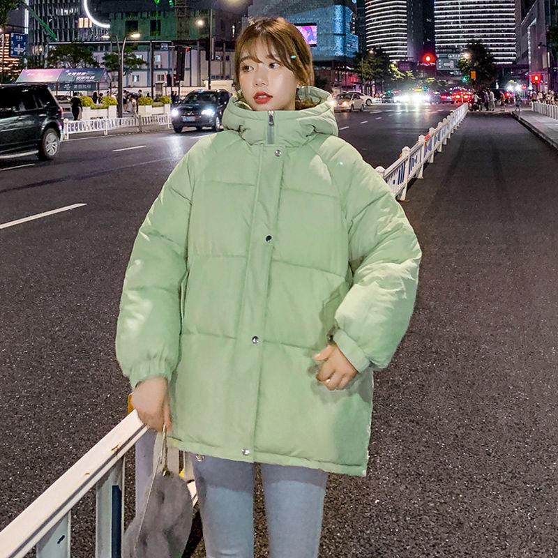 Light Green Oversized Puffer Jacket with Grey Pants and White Sneakers — Korean Winter Outfits