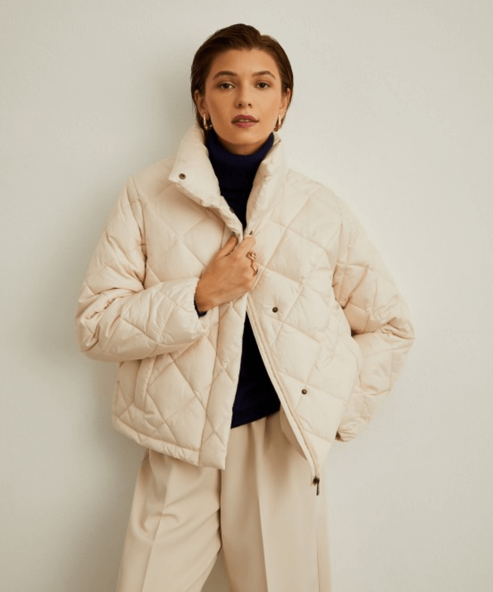 Cream Quilted Puffer Jacket with Navy Turtleneck Cream Quilted Puffer Jacket with Navy Turtleneck — Winter Capsule Wardrobe