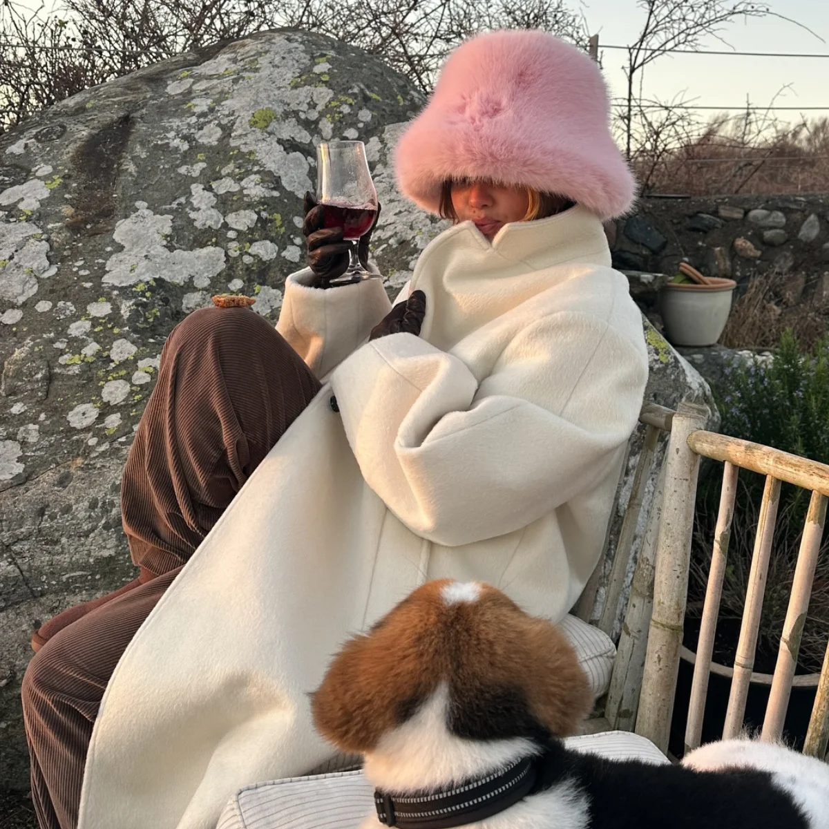 Cream Wool Coat with Corduroy Trousers and Faux Fur Hat — Winter Outfits for Warm Weather