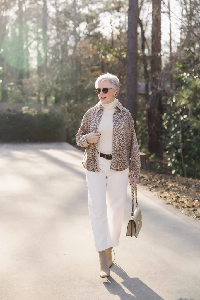 Leopard Print Shirt Jacket with Cream Turtleneck and White Pants — Winter Outfits for Women Over 70