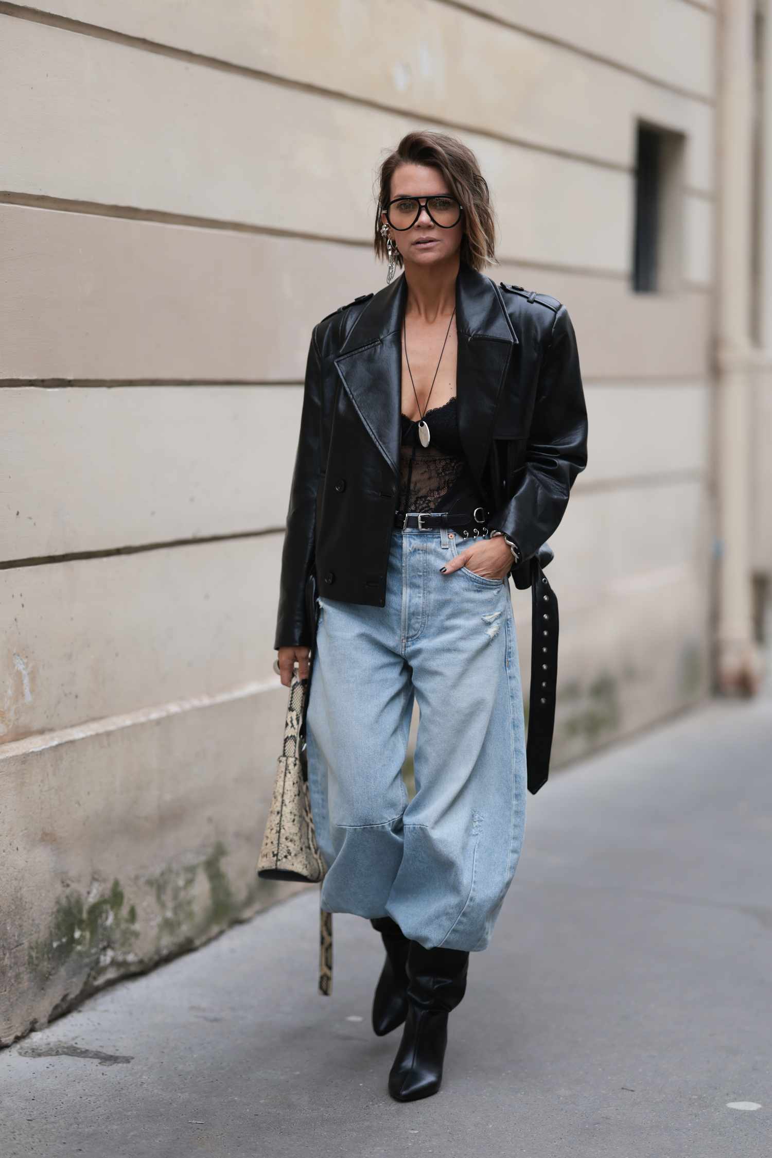 Edgy Night Out: Black Leather Jacket, Bodysuit, Jeans, and Slouchy Boots — Slouchy Boots Outfits