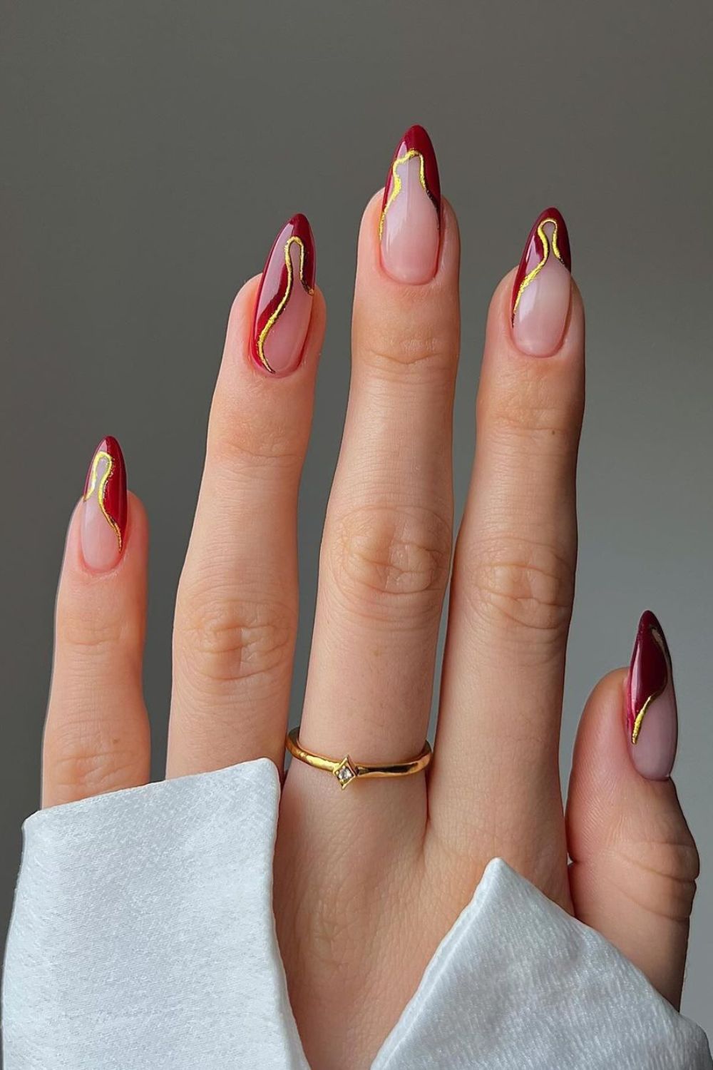 Sheer Pink Stiletto With Red Gold Abstract — Winter Acrylic Nail Colors