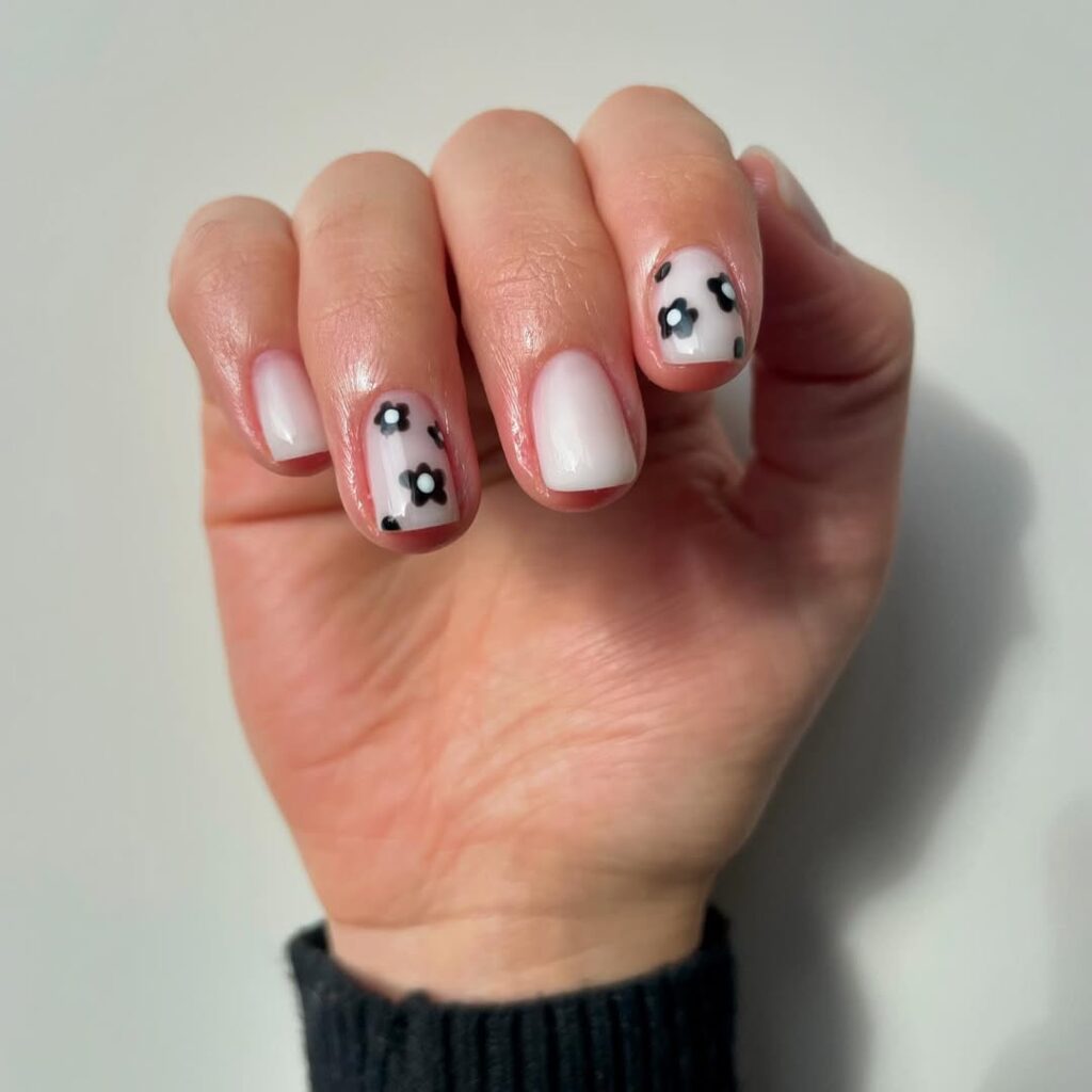 Milky White with Black Floral Accents — Short Winter Acrylic Nails