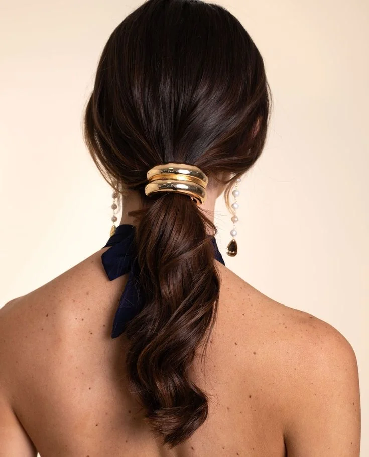 Low Ponytail With Gold Hair Cuff — Cute Winter Hairstyles