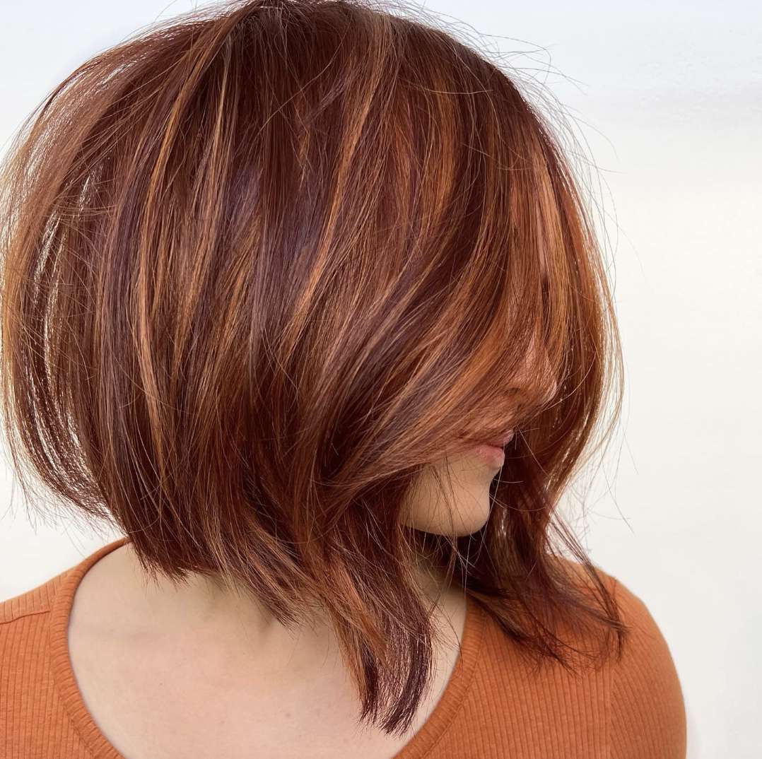 Angled Auburn Bob With Copper Highlights — Winter Shoulder Length Hairstyles