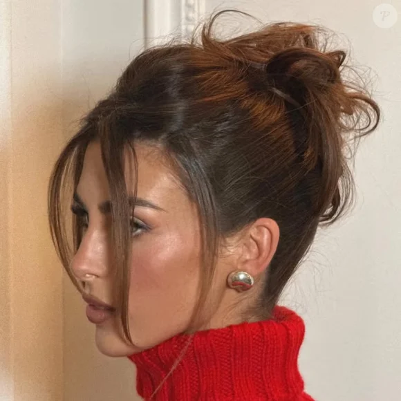 Messy Bun With Curtain Bangs Messy Bun With Curtain Bangs — Winter Hairstyles for Women Over 40