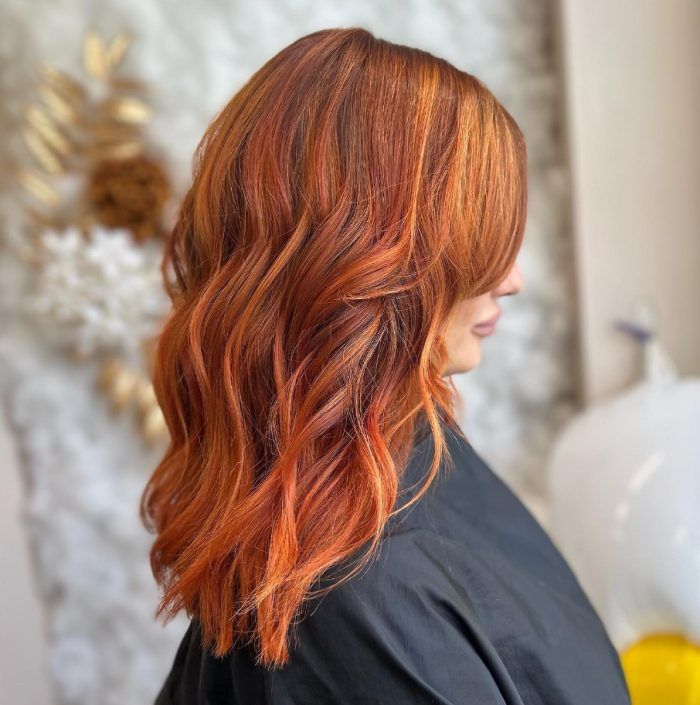 Vibrant Copper Lob With Blonde Highlights — Winter Shoulder Length Hairstyles