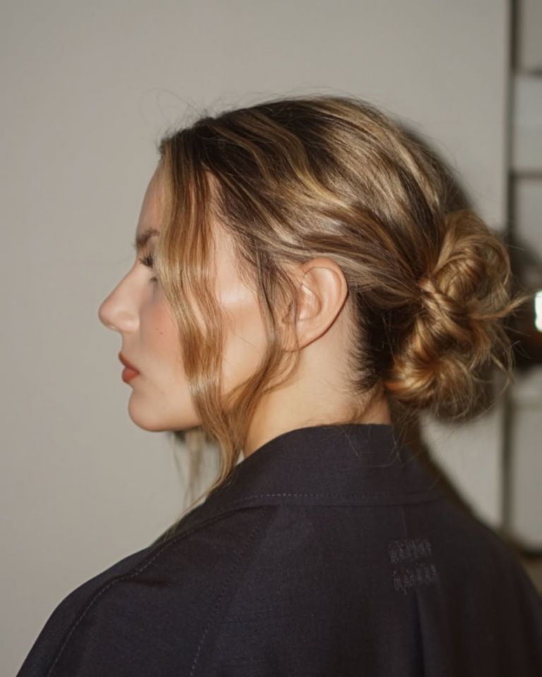 Messy Low Bun with Balayage and Wispy Bangs — Winter Updos