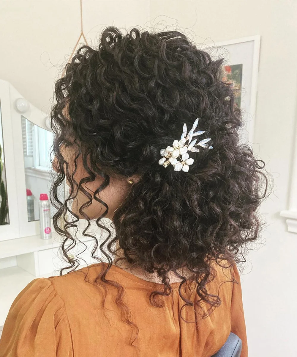 Thick Curly Half Up With Ornate Accessory — Winter Half Up Half Down Hairstyles