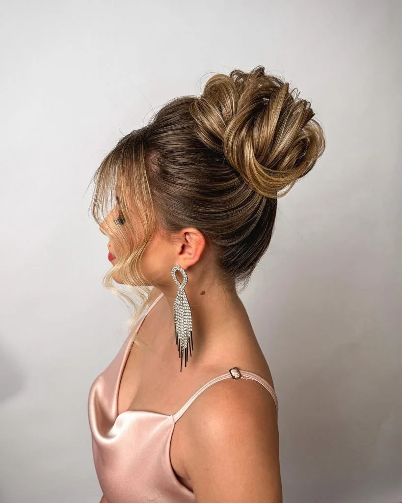 Voluminous Ash Blonde Bun With Curtain Bangs — Winter Wedding Hairstyles