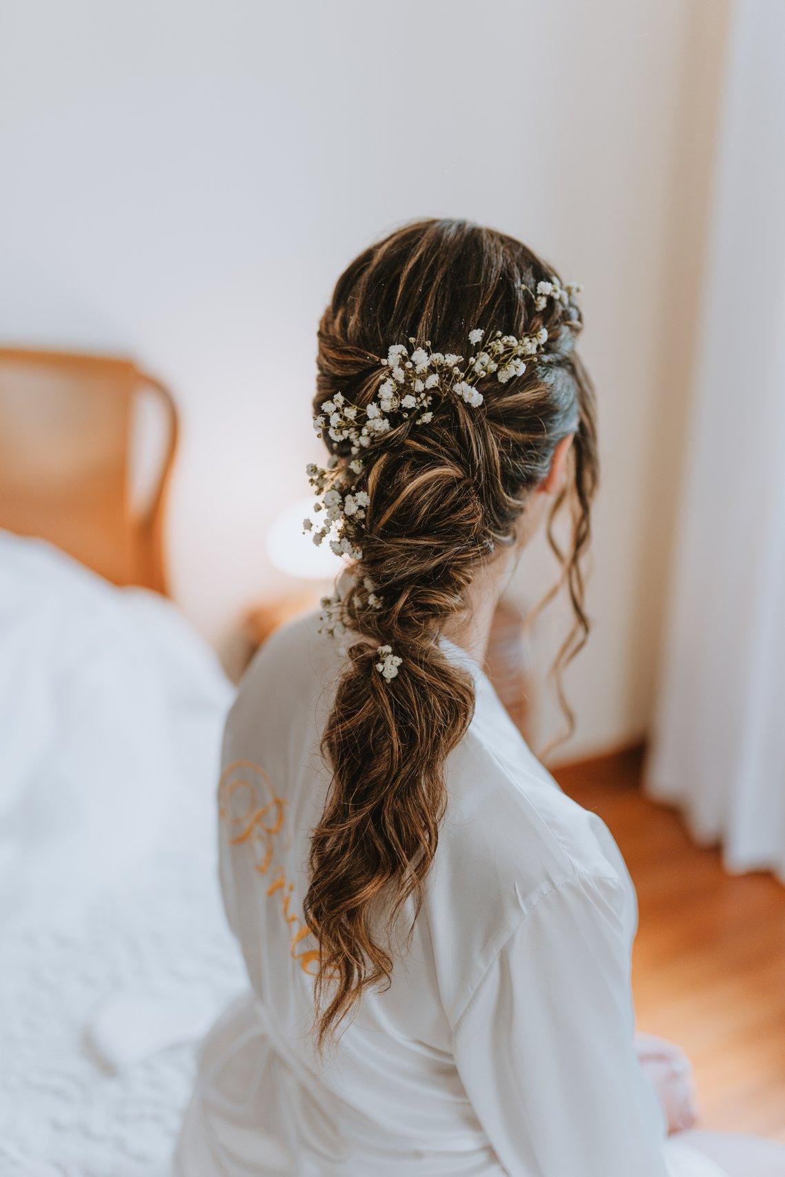 Dark Brown Braided Ponytail With Floral Crown — Winter Wedding Hairstyles