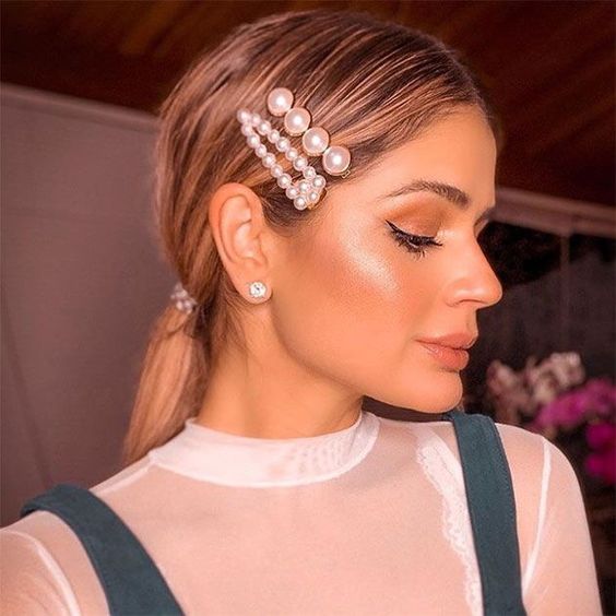 Sleek Ponytail With Pearl Clips — Winter Date Night Hairstyles