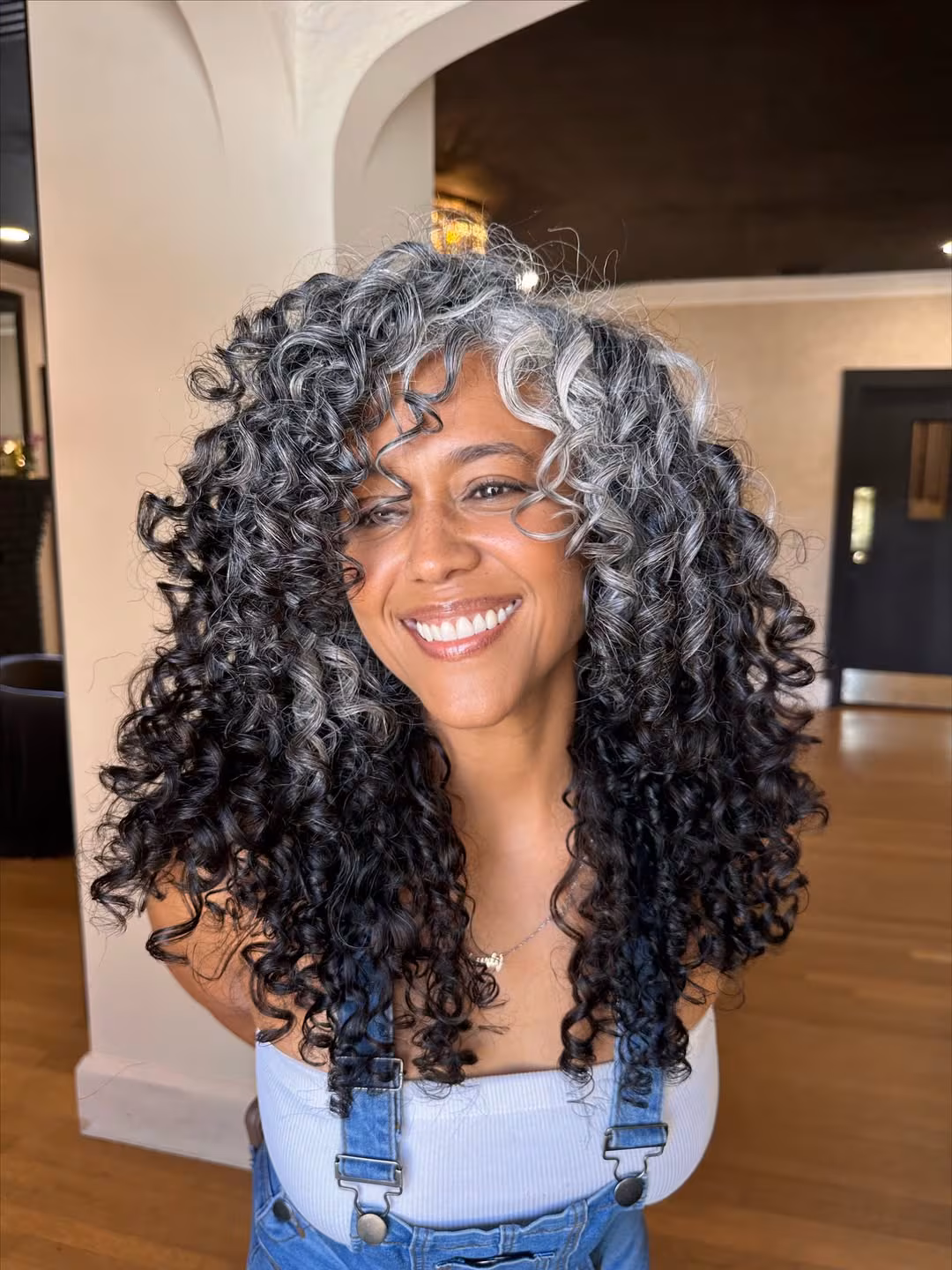 Layered Cut With Dark Gray Curls Layered Cut With Dark Gray Curls — Winter Hairstyles for Gray Hair