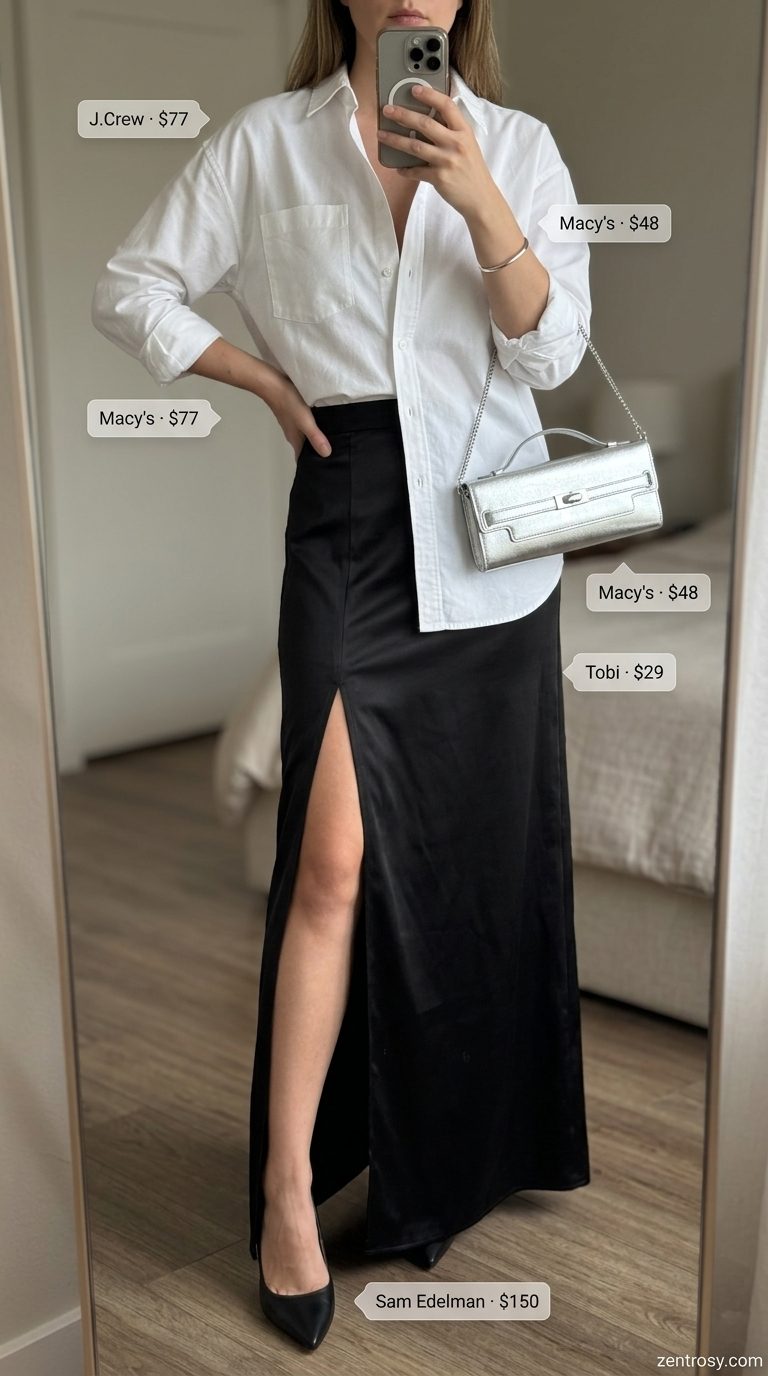 Urban chic outfit: black satin maxi skirt with slit, white oversized shirt, silver clutch. Maxi skirt with slit outfits summer 2026.