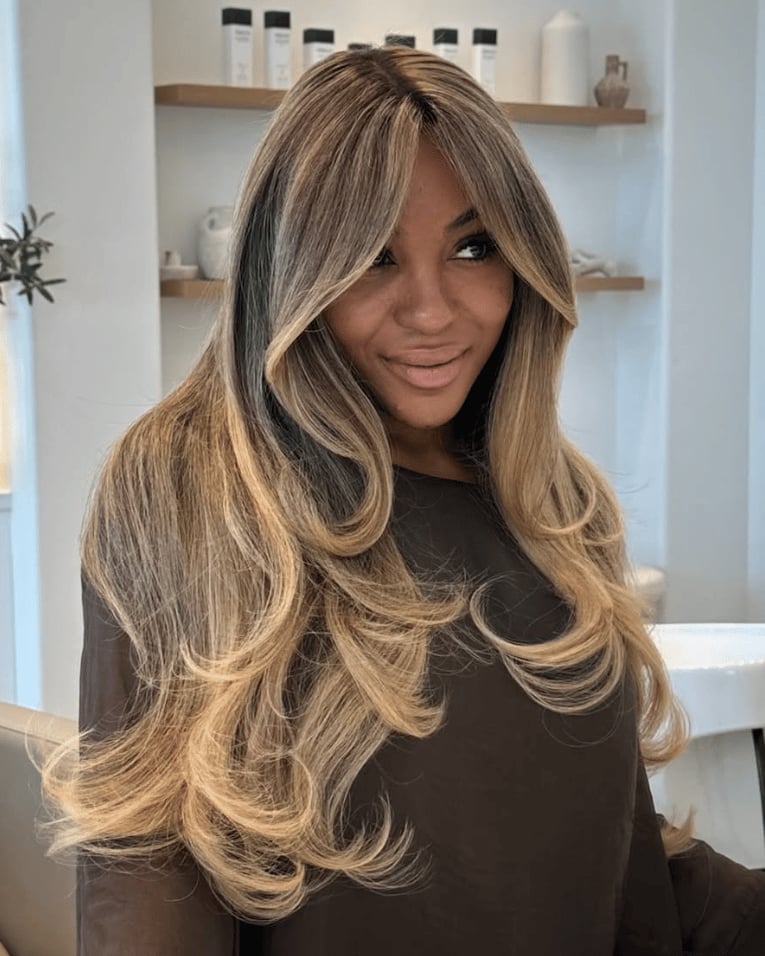 Dark Top with Softly Sculpted Layered Blonde Hair Dark Top with Softly Sculpted Layered Blonde Hair — Simple 90s Blowout