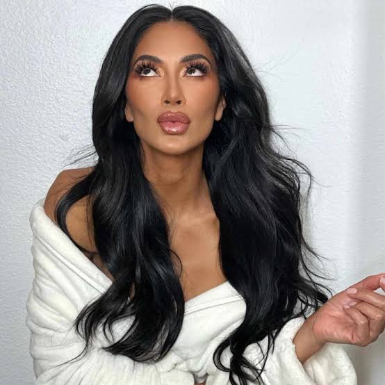 Mature Woman in White Robe with Voluminous Dark Hair Mature Woman in White Robe with Voluminous Dark Hair — Simple 90s Blowout