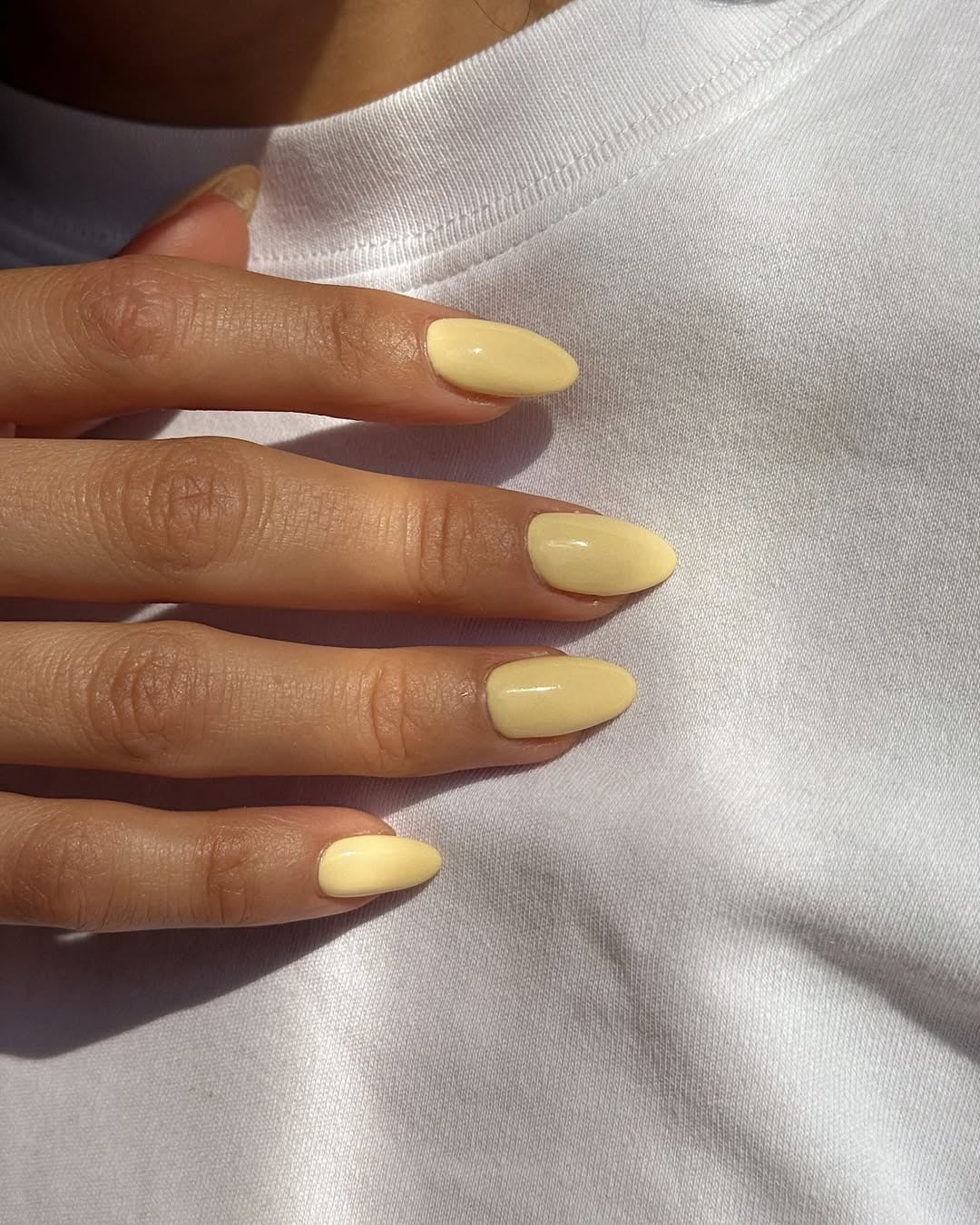 Short Almond Nails In Creamy Pale Yellow Short Almond Nails In Creamy Pale Yellow — Simple Almond Nails
