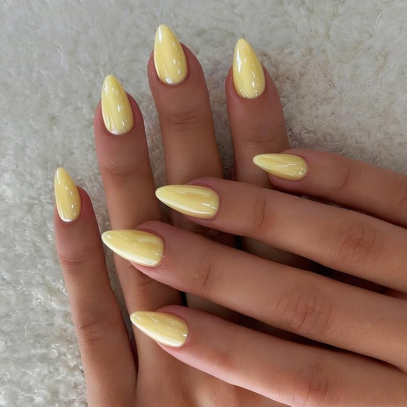 Long Almond Nails In Pale Yellow Glossy Polish Long Almond Nails In Pale Yellow Glossy Polish — Simple Almond Nails