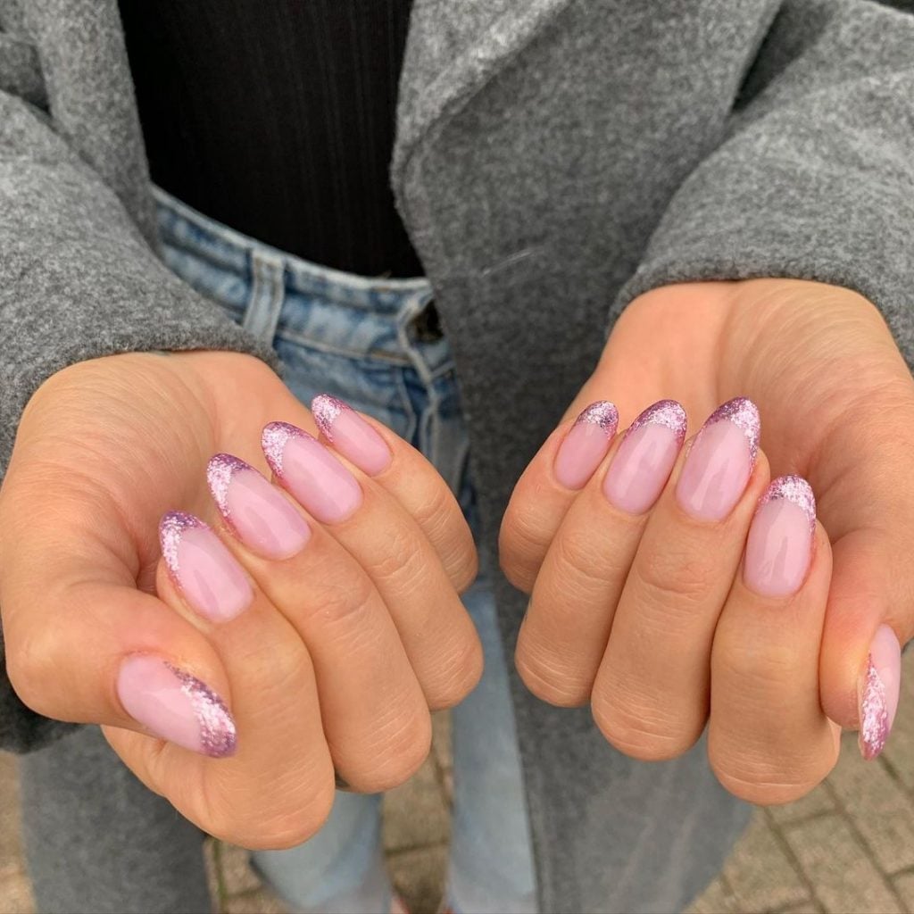 Pale Pink Glitter French Medium Oval Nails, Close-Up Take Pale Pink Glitter French Medium Oval Nails, Close-Up Take — Simple Birthday Nails