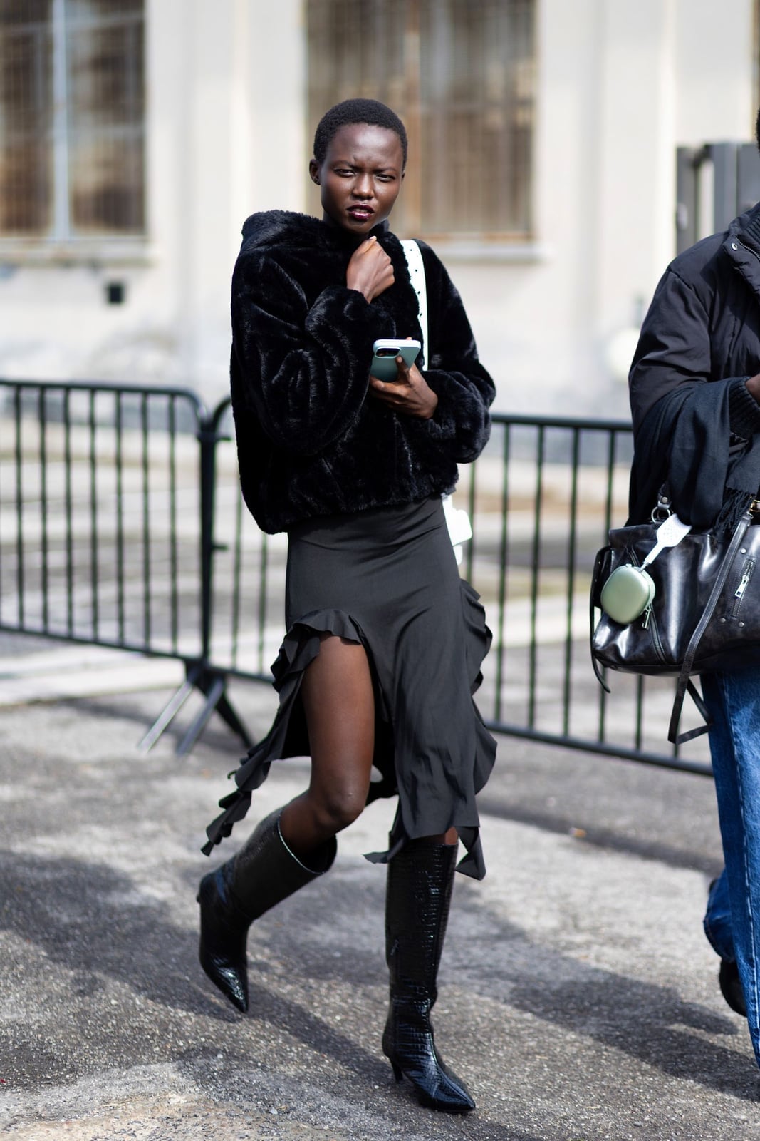 Black Boots With A Ruffled Skirt And Faux Fur Jacket Black Boots With A Ruffled Skirt And Faux Fur Jacket — Simple Black Boots Outfit