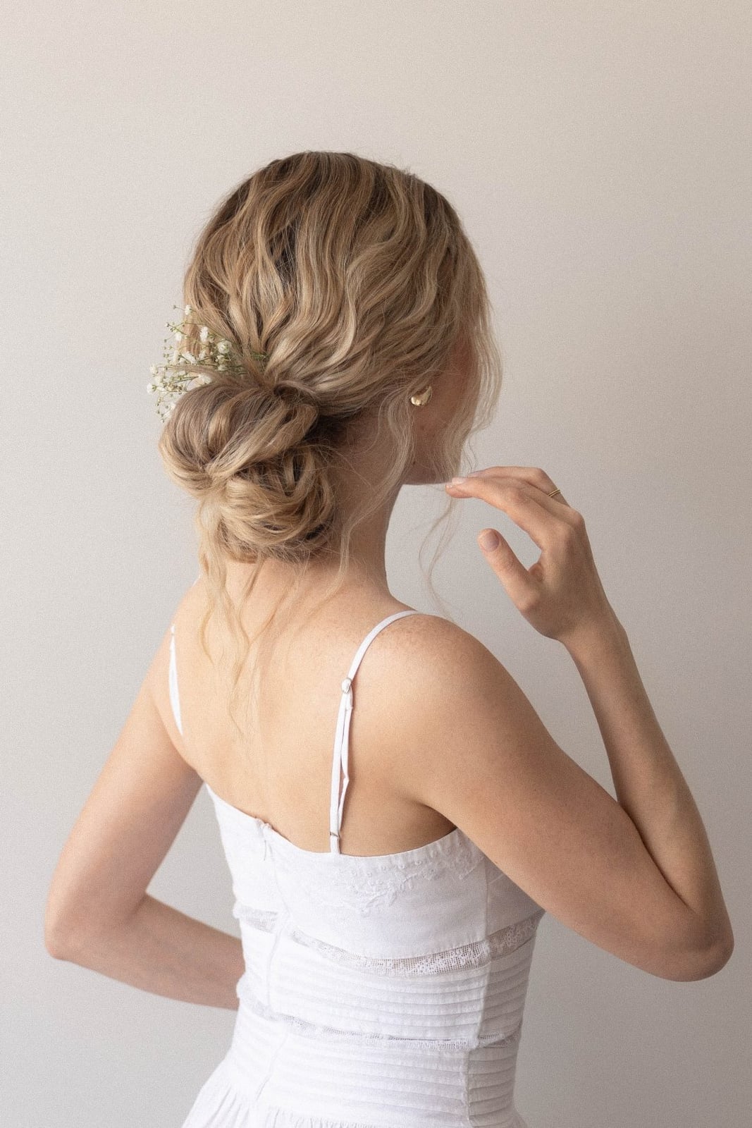 Loose Blonde Braided Bun With Flowers — Simple Bun Braids