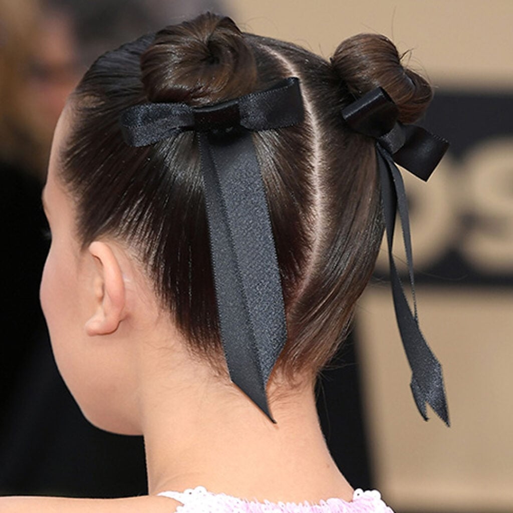 High Buns With Braids and Black Bows High Buns With Braids and Black Bows — Simple Children Hairstyles