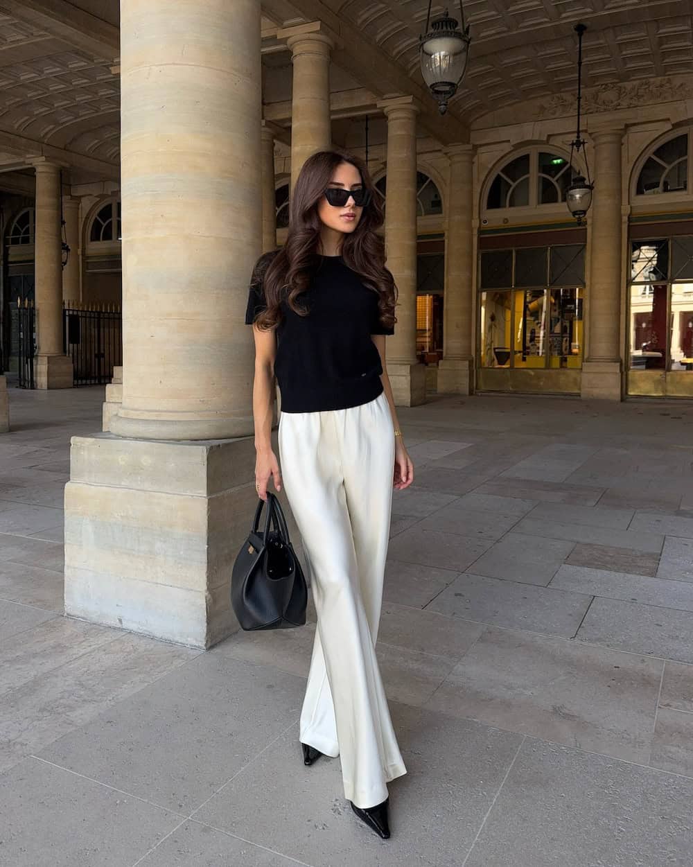 Black Knit Top With White Wide Leg Trousers, Close-Up Take Black Knit Top With White Wide Leg Trousers, Close-Up Take — Simple Corporate Outfits for Women