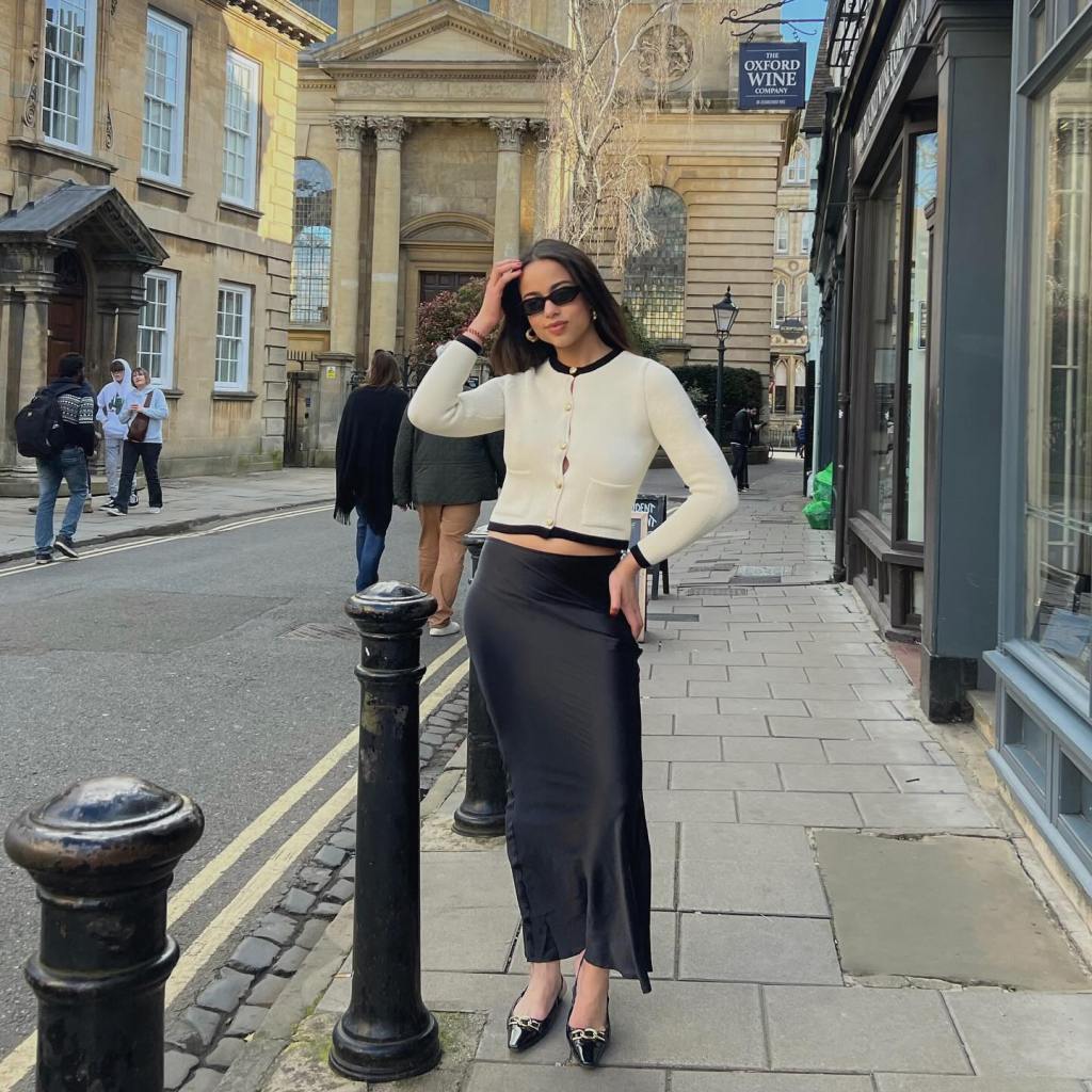 White Cropped Cardigan With Black Trim And Long Skirt — Simple Cropped Cardigan Outfits